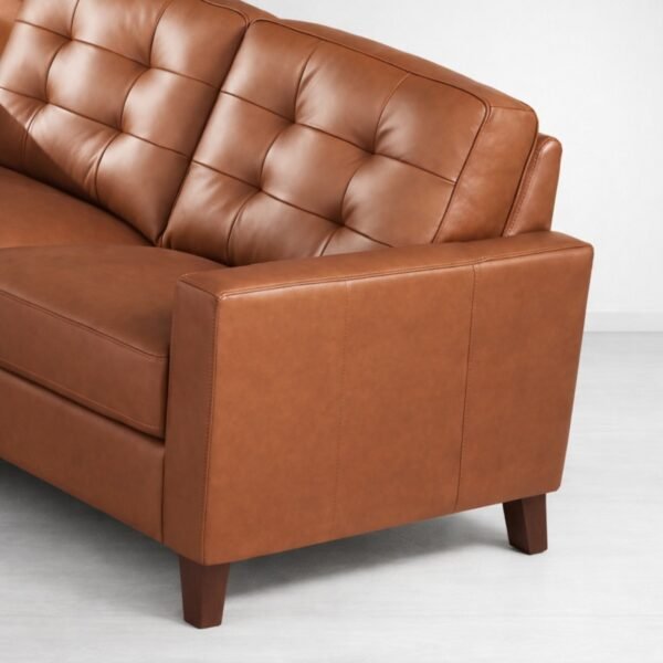 Tufted back detail on brown faux leather 3 seater sofa by INTERIORZE