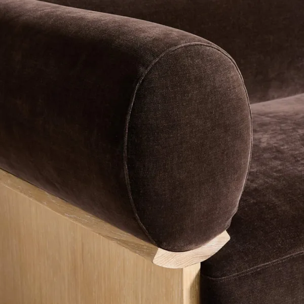 Close up of rounded bolster arm in mocha velvet on INTERIORZE sofa