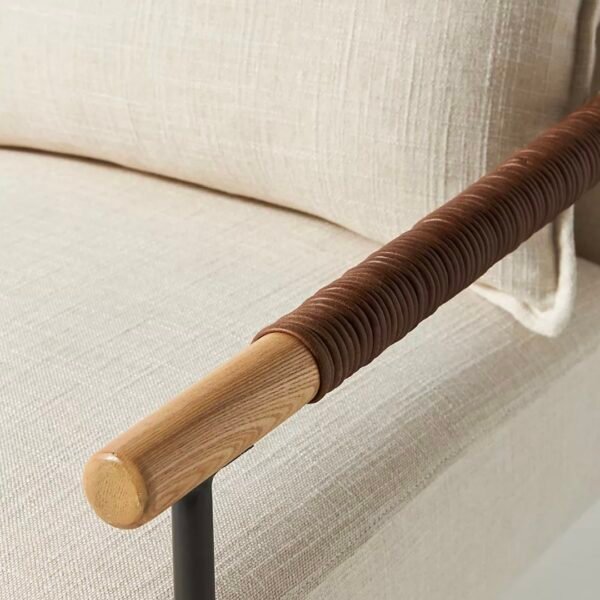 Natural teakwood armrest with wrap detailing on lounge chair