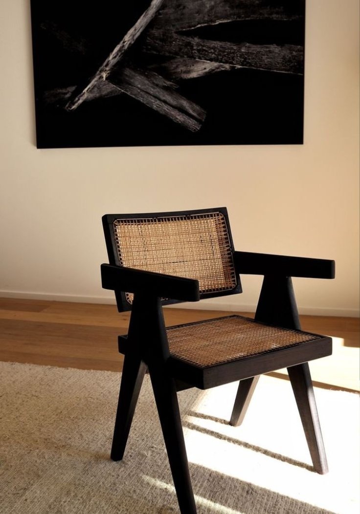 Black wooden cane chair with woven seat and back