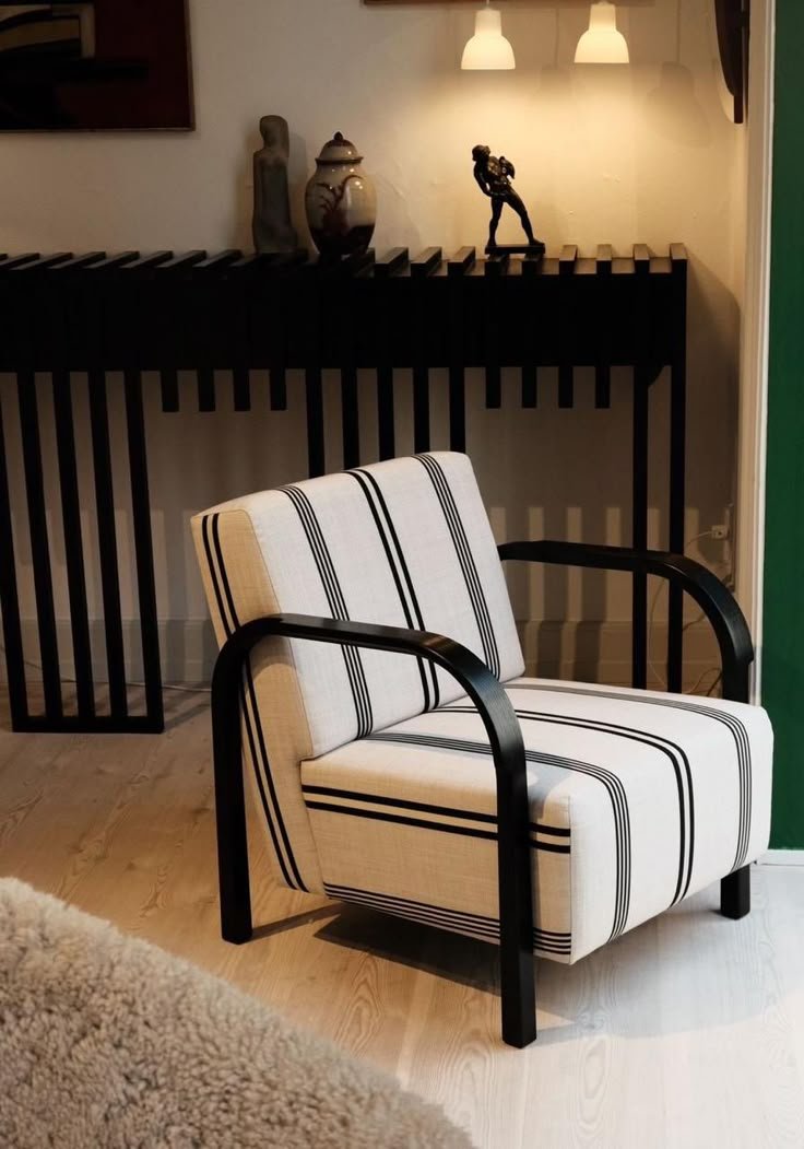 White striped accent chair with black curved arms