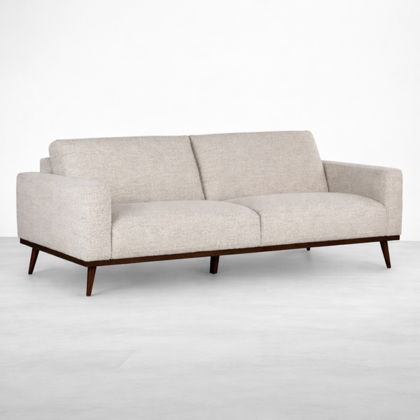 Beige fabric sofa with teakwood base and tapered legs by INTERIORZE