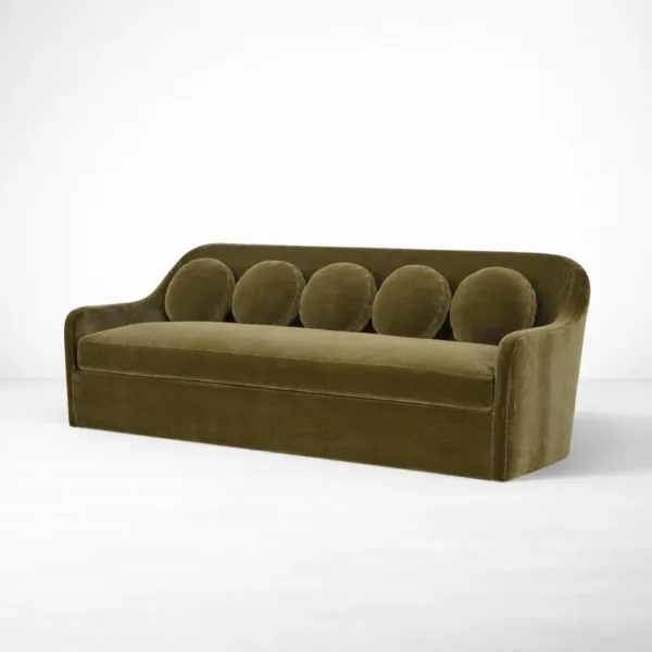 Olive green velvet sofa angle view with curved arms INTERIORZE Aurelia