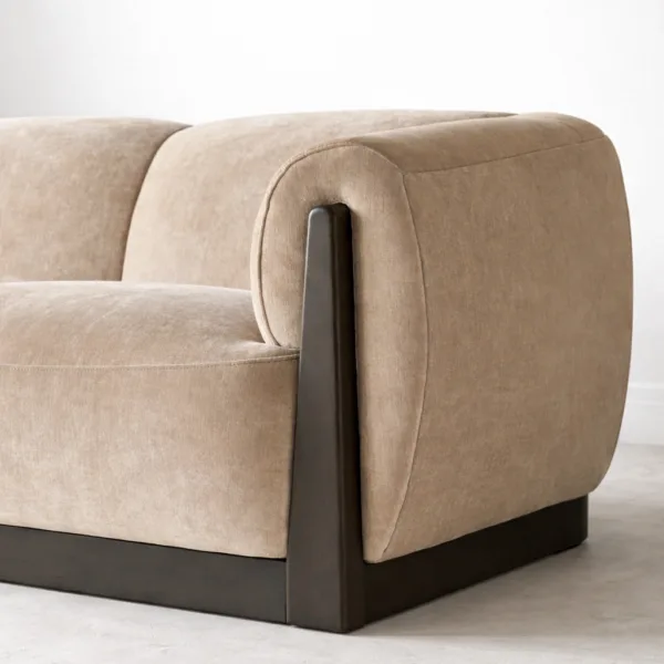 Beige velvet sofa angled view with teakwood base modern living room sofa INTERIORZE Teakcrest