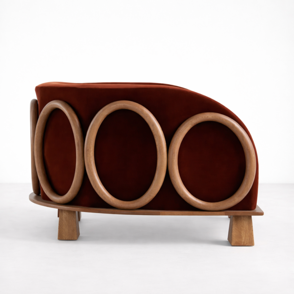 Side view of INTERIORZE ash wood ring lounge chair in rust velvet with circular ash wood rings
