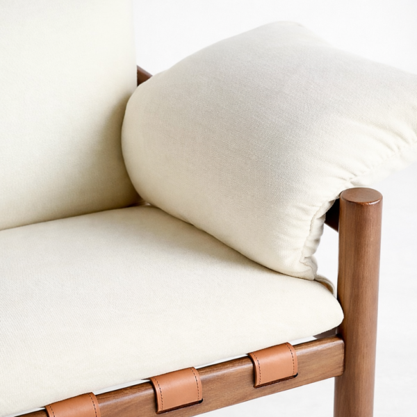 leather strap base detail on teakwood lounge chair