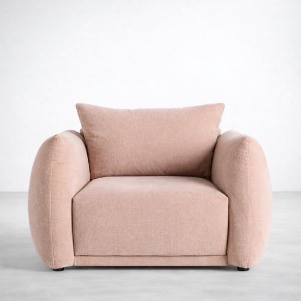 Front view of blush pink lounge chair with large back cushion