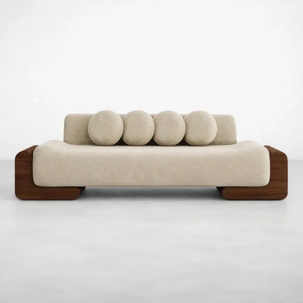 Ivory lounge sofa front view with round cushions and teakwood arms by INTERIORZE