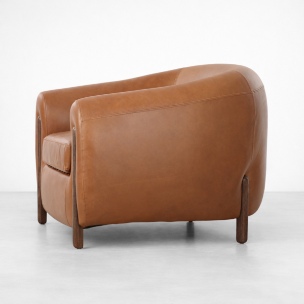 tan leather armchair side view curved arms supportive back