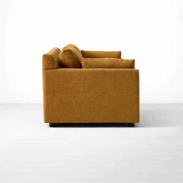 Side view of mustard brown fabric sofa with straight arms by INTERIORZE