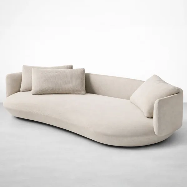 Ivory curved sofa with sculpted shape and loose cushions by INTERIORZE front angled view