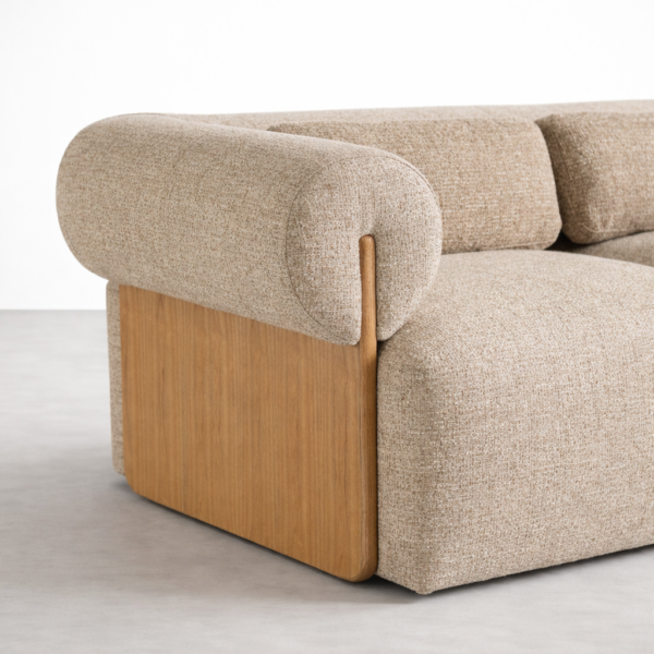 Side angle of beige fabric sofa with ash wood frame by INTERIORZE