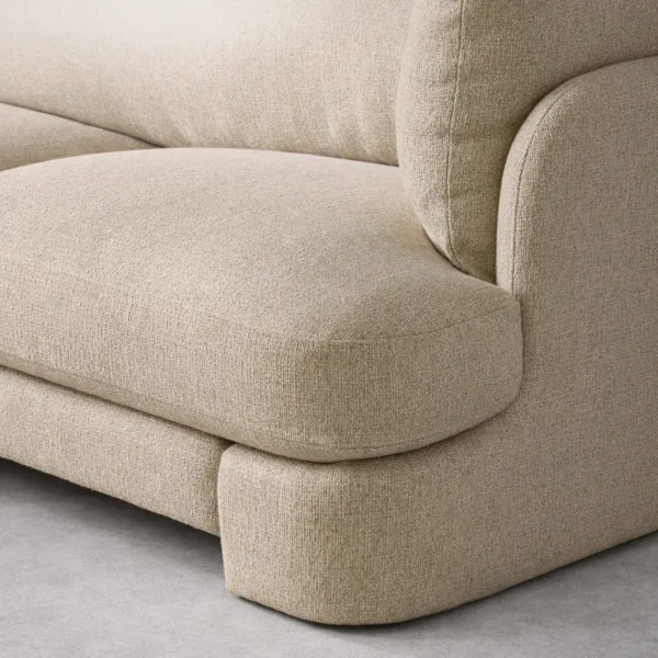 Close-up of teakwood beige modular sofa showing textured fabric upholstery
