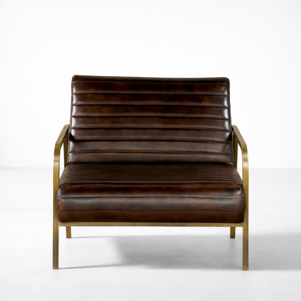 Brown leather accent chair with channel stitching and brass-toned frame, angled view