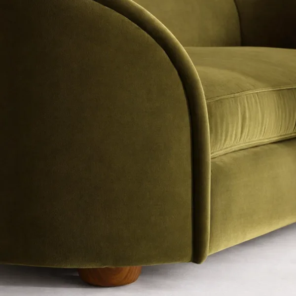 Olive green velvet sofa fabric close up curved arm INTERIORZE Curve