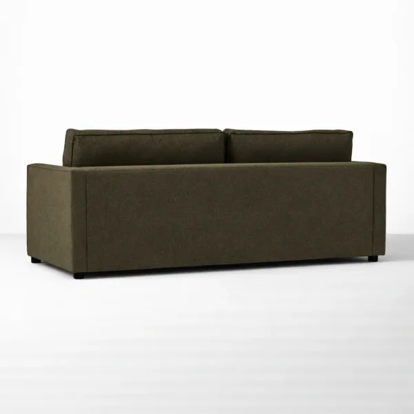 Back view of olive green sofa with minimal design by INTERIORZE
