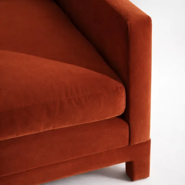 Rust velvet sofa fabric close up cushion and arm detail INTERIORZE