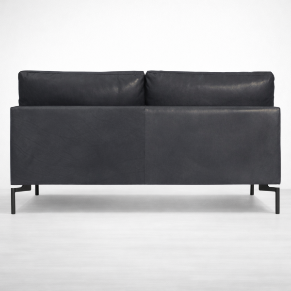 Black leather sofa with hardwood internal frame and metal legs by INTERIORZE