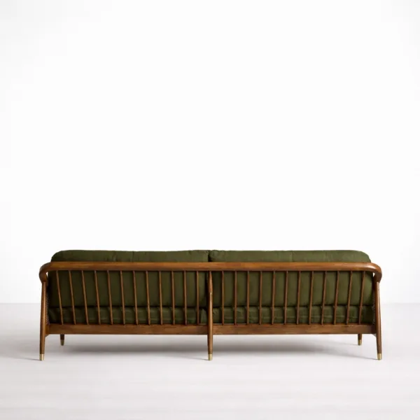 Back view of teakwood cane sofa with spindle back and olive green cushions