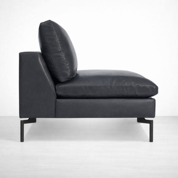 Side profile of black leather sofa with metal legs by INTERIORZE