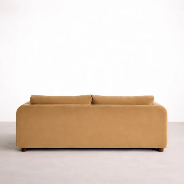 Beige velvet sofa back view with clean upholstered panels and low wooden feet