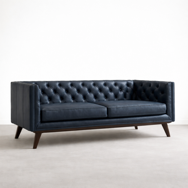 Front view navy blue tufted leather sofa with teakwood legs by Interiorze