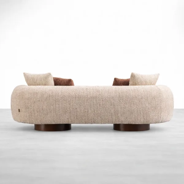 Teakwood boucle sofa in ivory upholstery with teakwood pedestal base by INTERIORZE