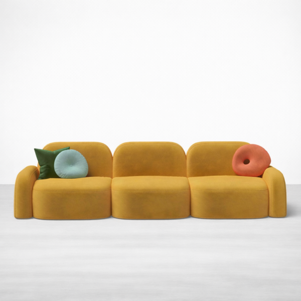 Front view of INTERIORZE Navya mustard yellow modular 3 seater sofa with curved seats and colourful cushions