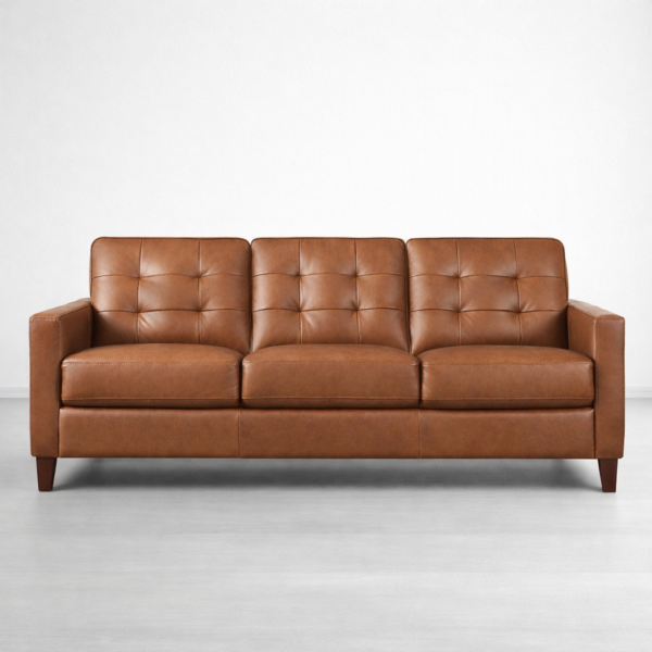 Tufted brown faux leather 3 seater sofa front view by INTERIORZE