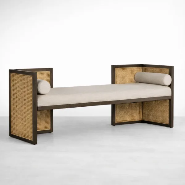 Angled view of teakwood and rattan sofa with upholstered beige seat by INTERIORZE
