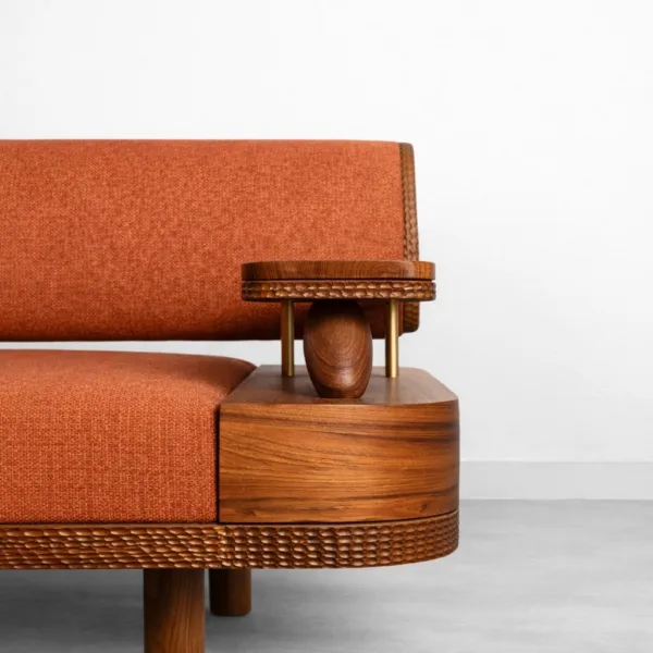 teakwood metal sofa angled view with cane panel and terracotta fabric