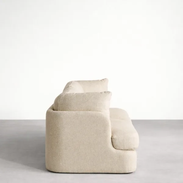 Teakwood beige modular sofa side view showing deep seat and rounded arm