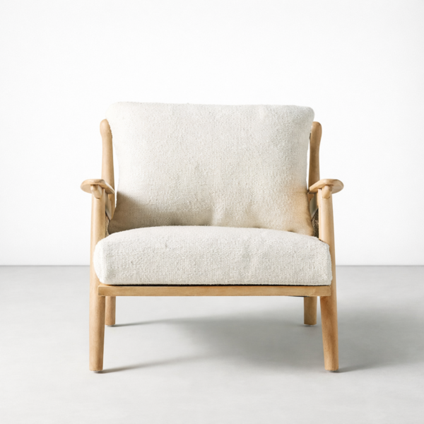 Angled view of INTERIORZE ash wood cane lounge chair in cream upholstery