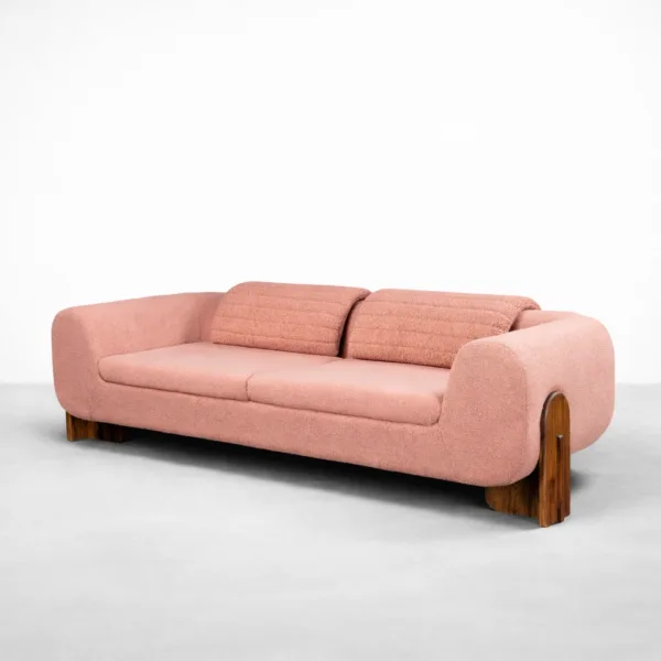 Blush bouclé 3 seater sofa angled view showing rounded arms and teakwood legs