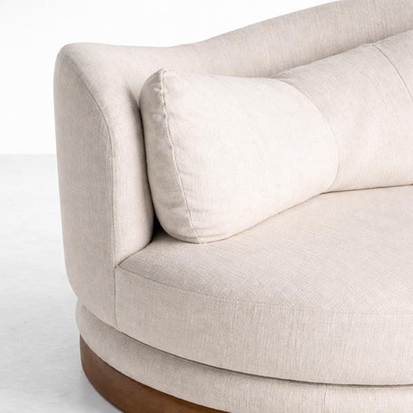 beige fabric upholstery detail on round swivel lounge chair