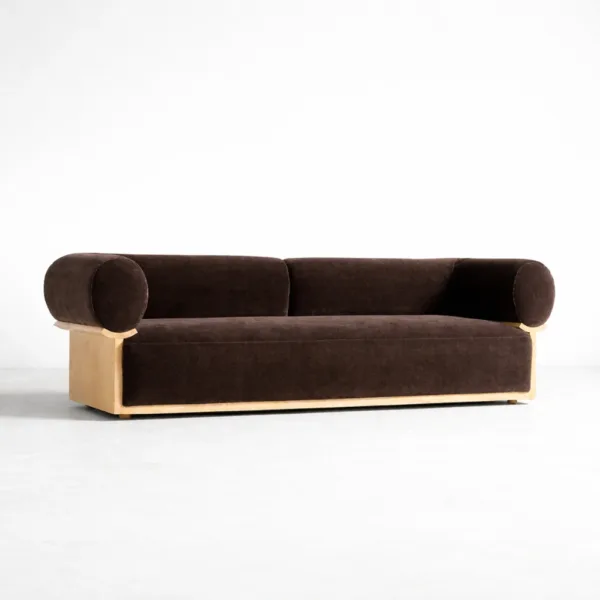 Mocha velvet sofa with ash wood frame and rounded bolster arms by INTERIORZE