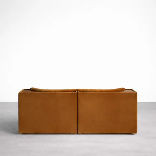 Back view of teakwood velvet sofa in caramel brown showing rear wooden tray ledge