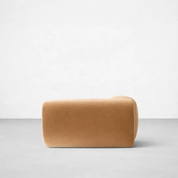 Mustard lounge sofa side view with sculpted rounded profile and teakwood internal frame by INTERIORZE
