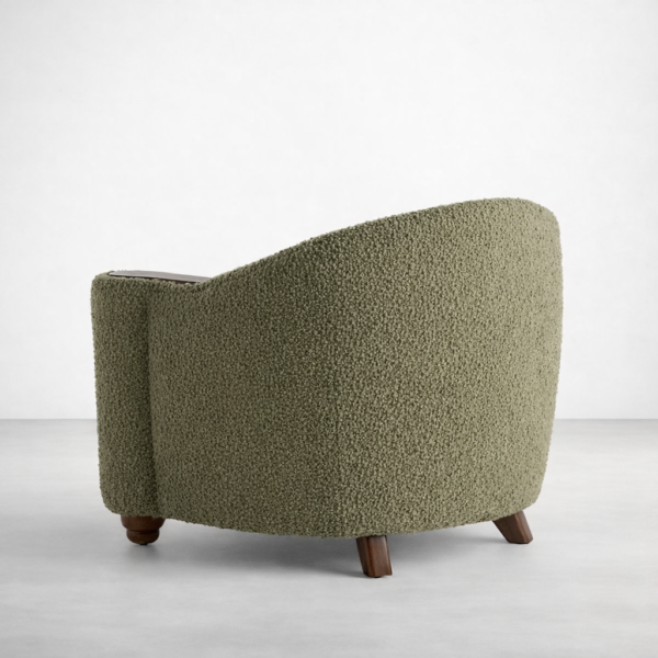 Back view of olive green boucle lounge chair with curved barrel shape