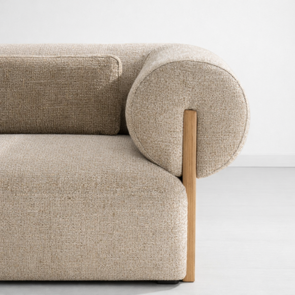 Rounded arm detail with ash wood support on beige fabric sofa by INTERIORZE