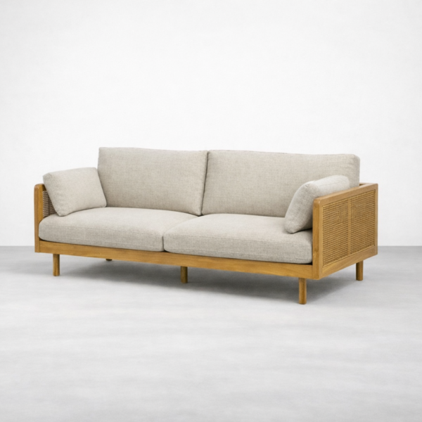 Angled view of teakwood rattan sofa in beige fabric by INTERIORZE