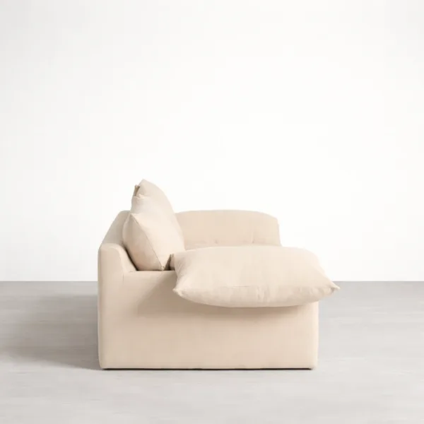Teakwood cream sofa side view with deep seat and cloud arm cushion