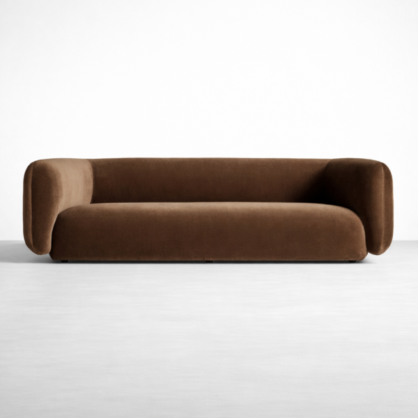 Brown velvet curved sofa by Interiorze with rounded arms and modern silhouette