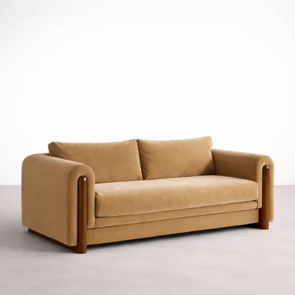 Beige velvet sofa front angle view with polished wood rails and soft cushions
