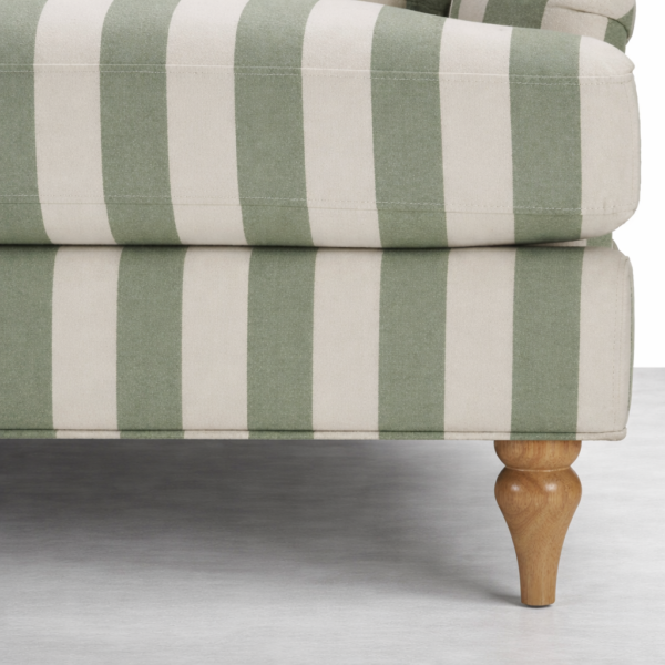 Close up of seat cushion and turned oak wood leg on INTERIORZE Green Striped Loveseat