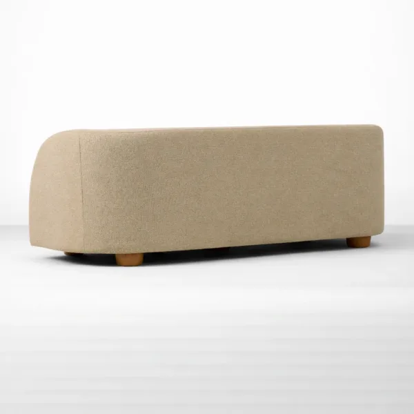 Back view of the INTERIORZE Luna beige upholstered sofa with clean curved silhouette