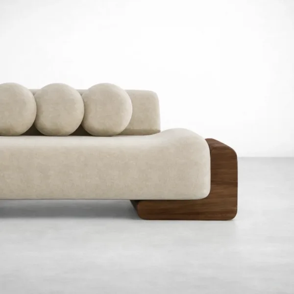 Ivory lounge sofa close up showing teakwood block arm and cream upholstery by INTERIORZE