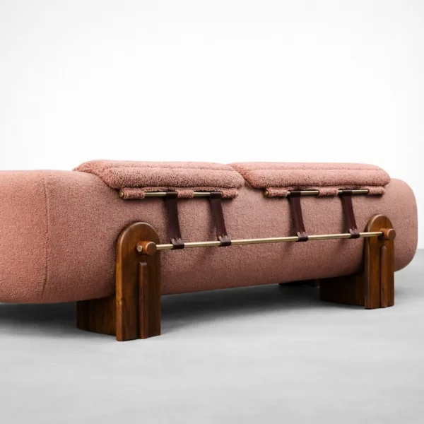Blush bouclé 3 seater sofa back detail with design accent and teakwood supports