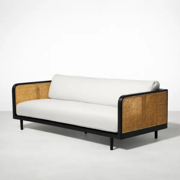 Front angled view of INTERIORZE Vihaan teak wood cane 3 seater sofa with ivory boucle upholstery and cane arms
