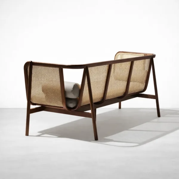Rear view of teakwood rattan sofa showing cane back panels by INTERIORZE